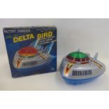 A boxed battery operated Delta Bird Spaceship, made in Japan by Nomura.