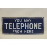 A 'You May Telephone From Here' double sided enamel sign, with good gloss, 22 x 9".