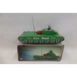 A boxed Chinese tinplate tank.