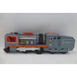 A Japanese tinplate friction drive Express locomotive, made by Daiya.