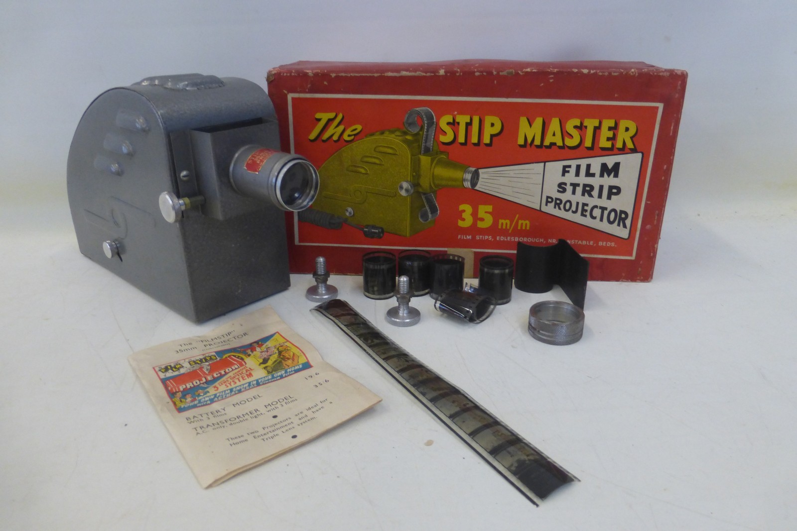 A boxed Stip Master film strip projector.