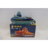 A boxed Chinese tinplate space tank.