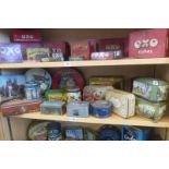 A shelf full of assorted tins including Mackintosh's.