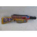 A Universal sparking tinplate ray gun, made in Great Britain.