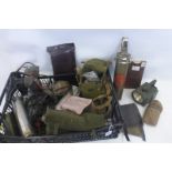 A large amount of military equipment including a tank crew headset and microphone.