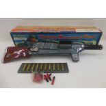 A boxed Japanese tinplate Automatic Crank Action Tracer machine gun with Bullet magazine, by Kanto.
