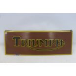 A reproduction Triumph rectangular enamel sign, 27 1/2 x 10".