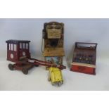 A Codec part tinplate 'Ranch Phone', a tinplate crane and a tinplate till.