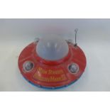 A plastic Moon Ranger Mercury Mark IV 'Bump and Go' Flying Saucer, made in Hong Kong.