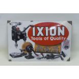 An unusual convex pictorial enamel sign advertising Ixion tools, with some restoration to the