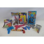 A selection of toy guns etc.