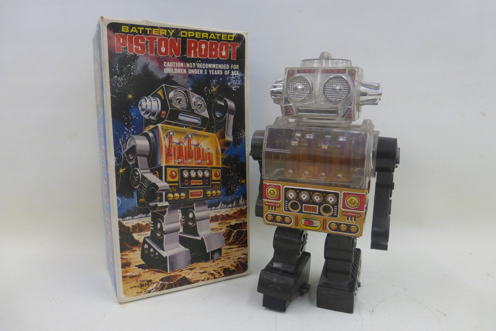 A boxed Japanese battery operated piston robot by Horikawa.