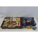 A box of boxed die-cast models and a tray of loose models including a tinplate Mercedes-Benz, a