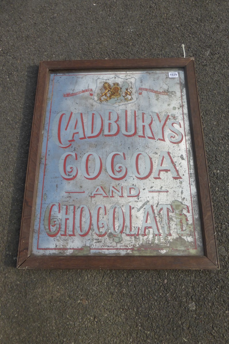 A Cadbury's Cocoa and Chocolate advertising mirror with Royal coat of arms 'By Appointment to the