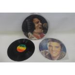 A Bob Marley E.P. and two Elvis E.Ps.