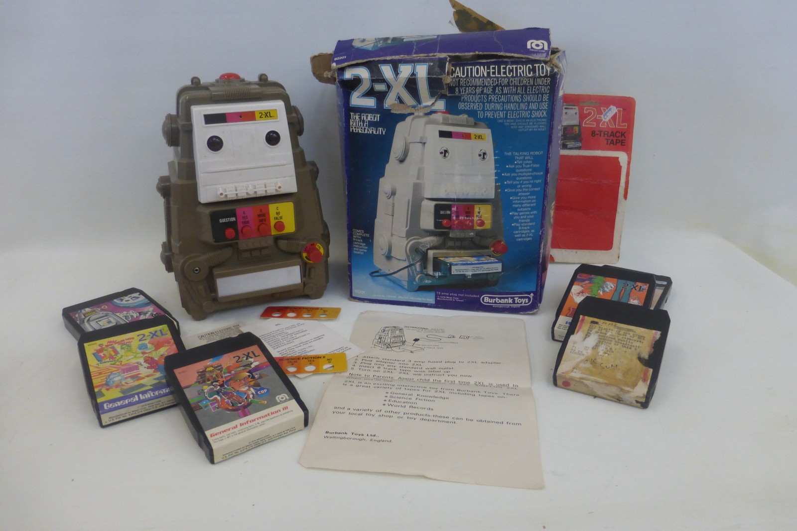 A boxed Burbank Toys 2-XL robot with cartridges.