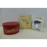 A Christys' London Hats oval hatbox, a Bradleys 'Super Suede' Hats rectangular showcard 10 x 12 1/2"