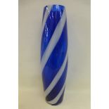 A tall blue glass vase.