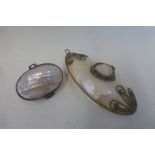 Two M.O.P oval purses with brass mounts.