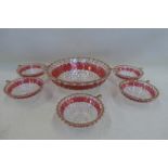 A set of unusual hobnail and cranberry tinted Italian glass cups and a matching bowl.
