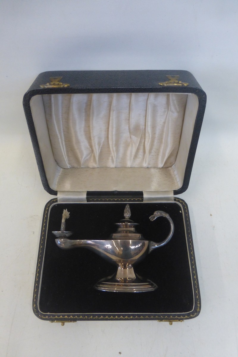 A rare cased silver oil lamp, Birmingham 1960.