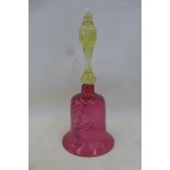 A cranberry and vaseline glass bell.