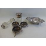 Three small silver salts, a silver topped glass scent bottle, a bonbon dish etc.