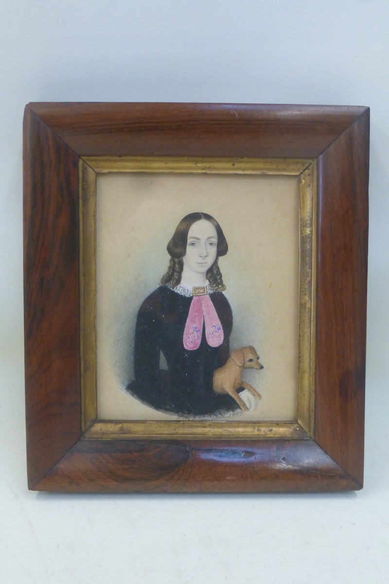 A naive school portrait miniature depicting a girl with a terrier, signed W. Murray and dated 1849.