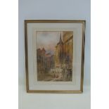 A framed and glazed late 19th Century/early 20th Century watercolour of a Prague street scene,