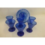 A set of six blue soda glass tumblers and a matching plate.