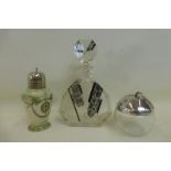 An Art Deco style decanter, a glass lidded pot in the form of an apple and one other.