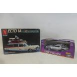 An AMT Ghostbusters II Ecto 1A model, constructed, plus a 'Back to the Future' time machine.