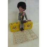 A boxed Pelham Puppet - Pop Singer no. 1, a guitarist in striped outfit based on one of the Beatles,