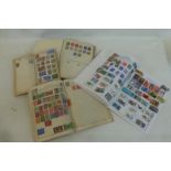 Four assorted stamp albums.