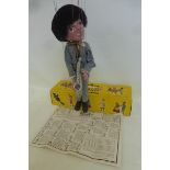 A boxed Pelham Puppet - Pop Singer no. 1, a saxophonist in striped outfit based on one of the