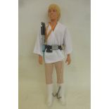 An original Kenner 12" Star Wars figure - Luke Skywalker, complete with medallion, light saber and