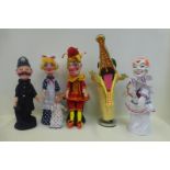 A Punch and Judy set comprising a white faced clown, Mrs Punch, Baby, Policeman, Mr Punch and