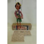 A 1950s Pelham Puppet pre-Disney 'Pinocchio' with original box, tissue and instructions; wooden body