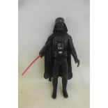 An original Kenner 12" Star Wars figure - Darth Vader with saber, in near excellent condition.
