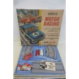 A large Airfix Motor Racing scalextric style set with two cars, one being a Lotus Cortina.