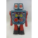 A Japanese part tinplate and plastic 'gear' robot, made by Horikawa.