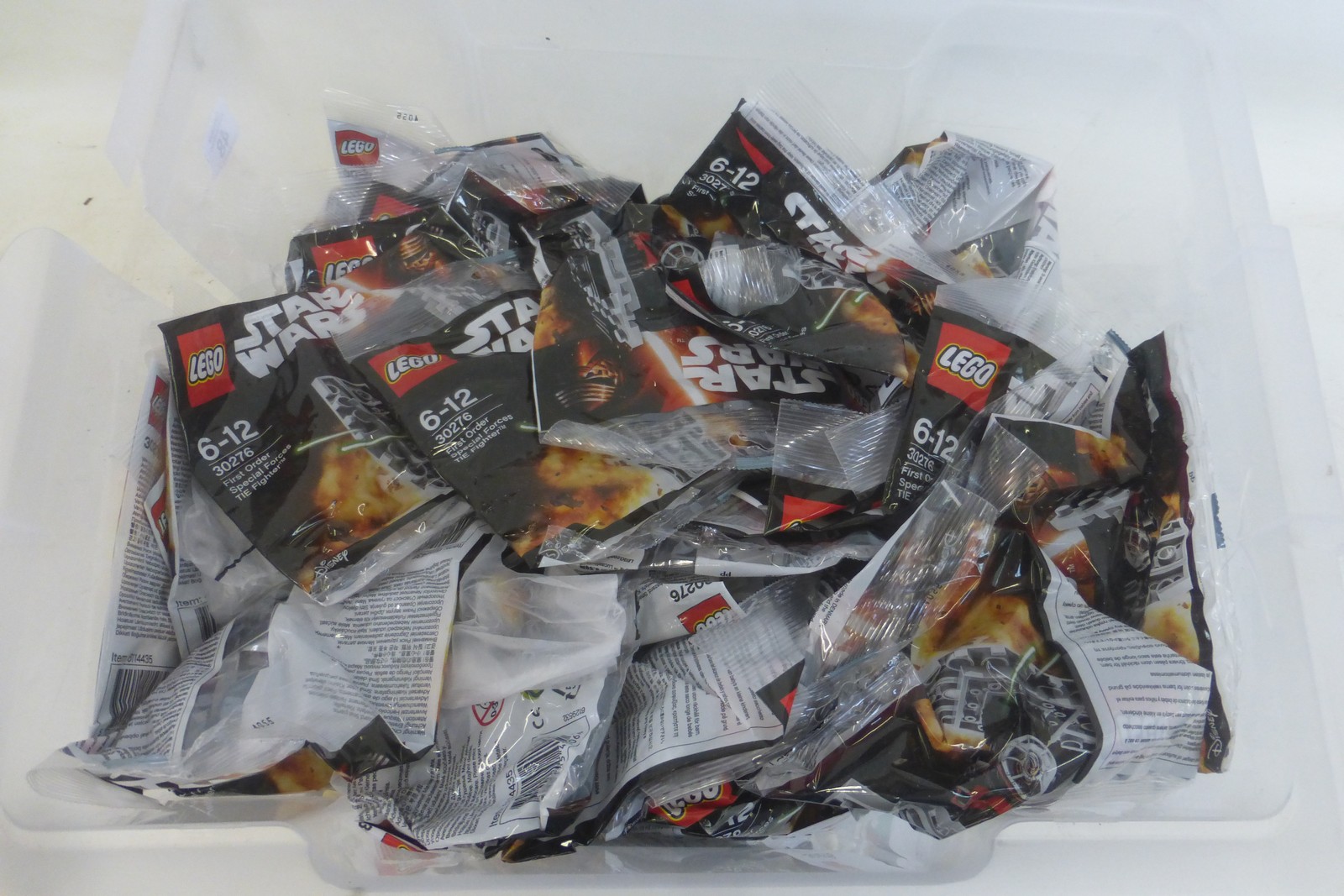 A box of Lego Star Wars packets.