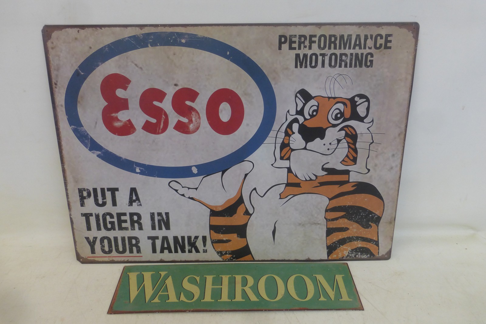 A reproduction Esso 'Tiger in your tank' tin advertising sign, 27 1/2 x 19 3/4" and a