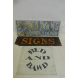 A glass sign for O'Sullivan's Supply Stores and two others.