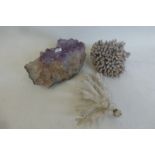 Two pieces of coral and a lump of amethyst.