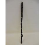 A 19th century rosewood flute, stamped Kaloton with block mounted keys, one absent.