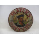 A Player's Navy Cut circular pictorial tin advertising sign with central sailor image, 50 1/2"