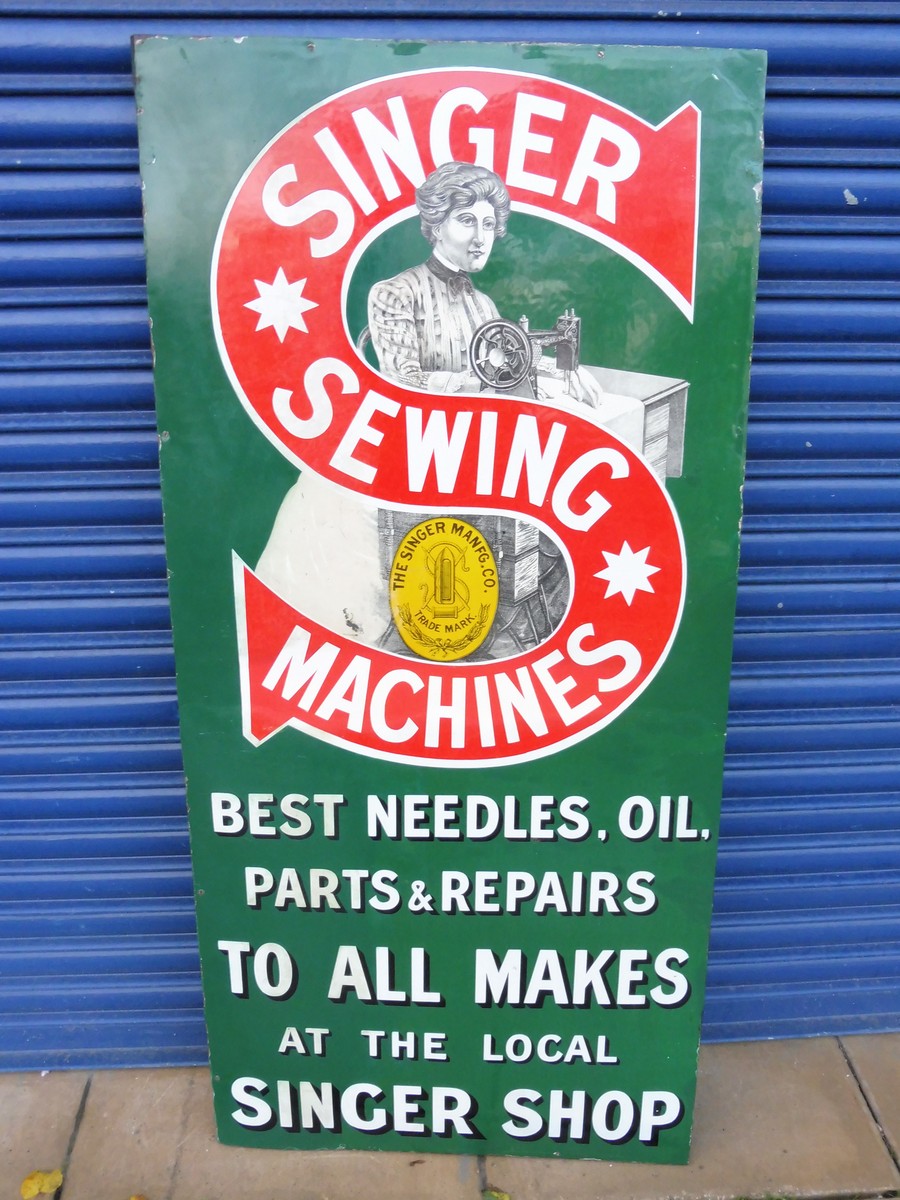 A Singer Sewing Machines pictorial enamel sign with some professional restoration, 27 x 57 1/2".