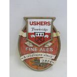 An Ushers of Trowbridge shaped pub plaque with inset enamel sign, 13 3/4 x 18 1/2".