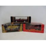 A boxed Burago 1/18 scale Volkswagen Beetle, a boxed Maisto Jaguar XK8 and one other.